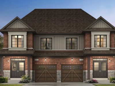 Traditional brick semi-detached home with wooden garage doors and twin entryways