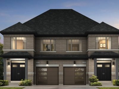 Modern semi-detached home with neutral brick tones and sleek garage doors