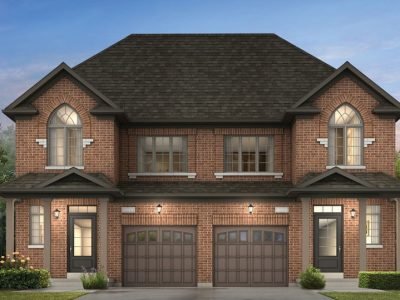 Red brick semi-detached with arched windows and heritage-inspired details