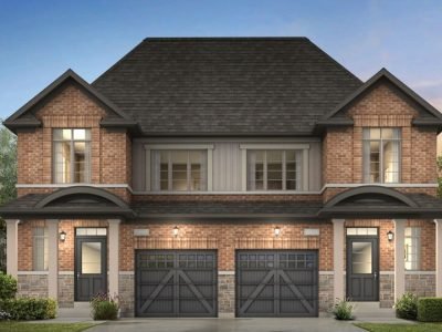 Semi-detached home with stone base, gabled rooflines, and dark accents
