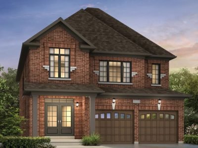 Red brick detached home with colonial-style detailing and arched garage