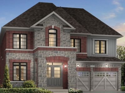 Elegant two-storey home with arched center window and barn-style garage doors